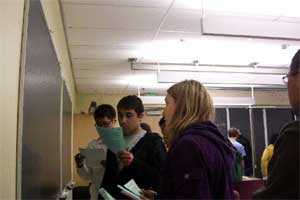 Students presenting work at blackboard in CLASP laboratory.