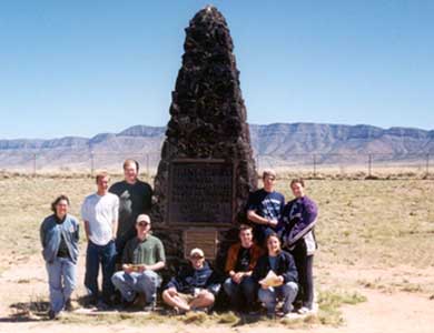 The author's students on a bi‑annual visit to the Trinity test site monument, 2003.